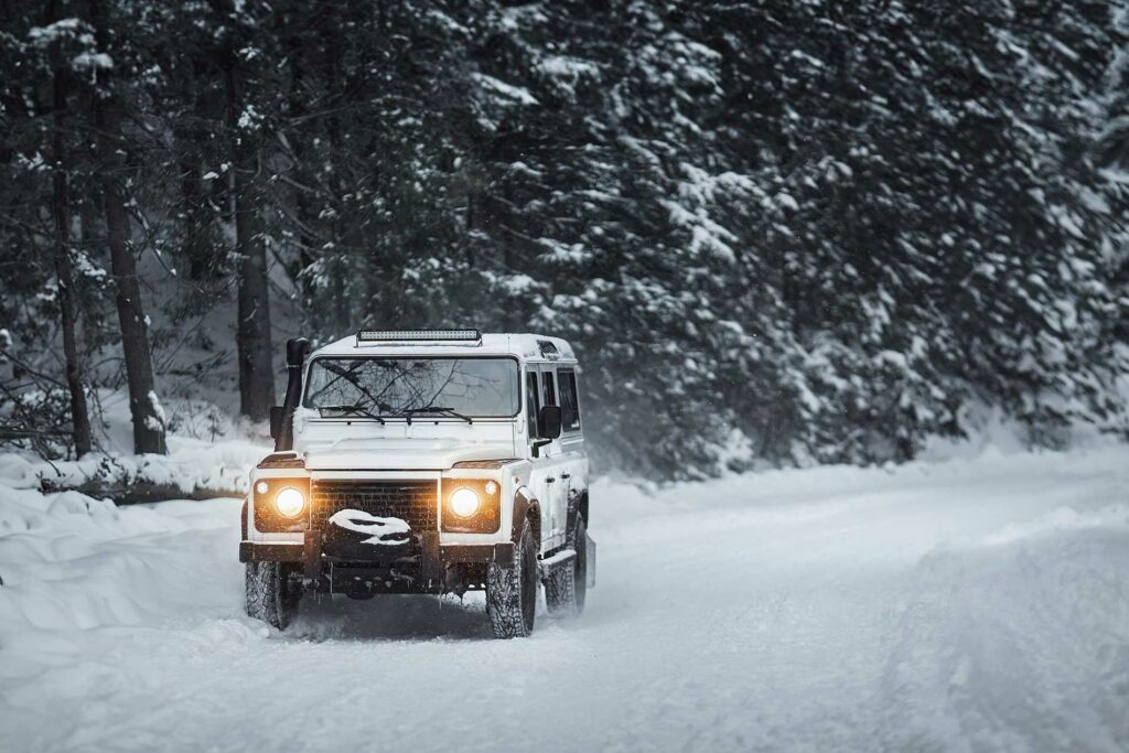 jeep driving through the snow